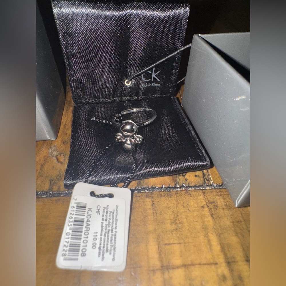 Calvin Klein adjustable fidget Ring with Pendant.